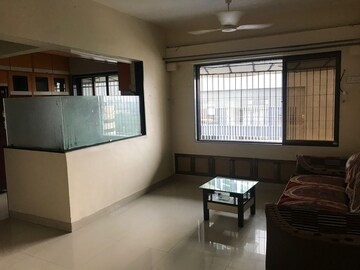 Living Room in 1 BHK Apartment at Ajmera Odyessey Apartment, Bhakti Park – for Rent