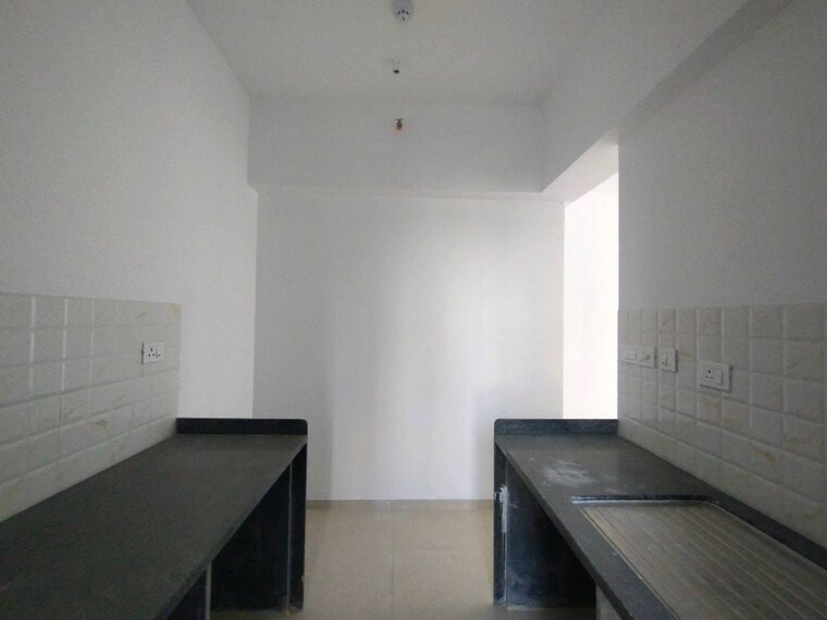 Kitchen, kalpataru-immensa-b 3 Bedroom 944 Sq.Ft. Apartment In Kolshet Road Thane 9615804