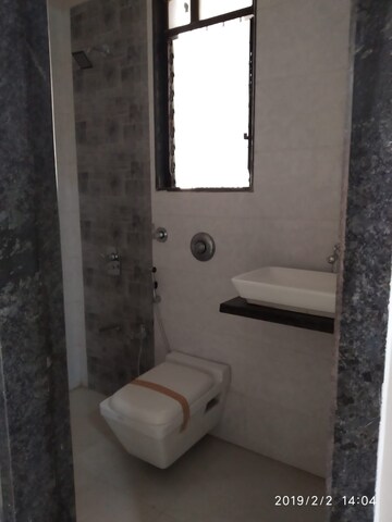 Bathroom in 2 BHK Apartment at Shree Tirupati STG Signature Residency, Patlipada – for Rent