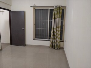 Room in 2 BHK Apartment at Mittal Arcvista, Dhanori – for Rent