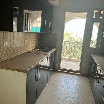 Kitchen in 3 BHK Apartment at DLF The Skycourt, Nawada Fatehpur – for Rent