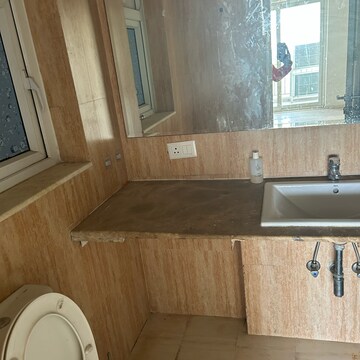 Bathroom in 3 BHK Apartment at DLF The Skycourt, Nawada Fatehpur – for Rent