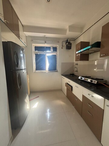 Kitchen in 1 BHK Apartment at Puranik City Phase III, Ghodbunder Road – for Sale