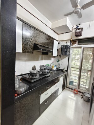Kitchen in 2 BHK Apartment at Cosmos Jewels, Ghodbunder Road – for Rent