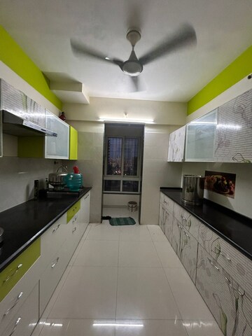 Kitchen in 2 BHK Apartment at Green Acres Apartment, Waghbil – for Rent