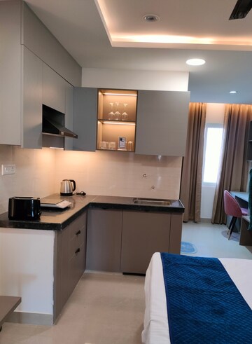 Kitchen in Studio Apartment at Okay Plus Solitaire Suites, Ramnagariya – for Sale
