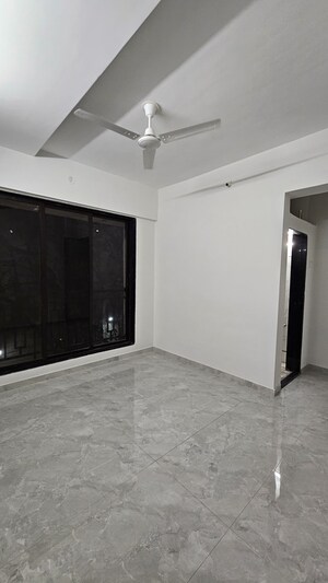 Living Room in 2 BHK Apartment at Avaas Deepanjali CHS, Nilemore – for Sale