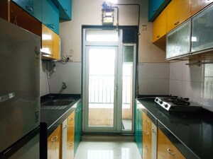 Kitchen in 3 BHK Apartment at Rustomjee Athena, Majiwada – for Rent