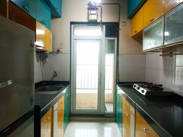 Kitchen in 3 BHK Apartment at Rustomjee Athena, Majiwada – for Rent