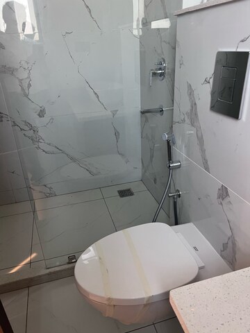 Bathroom in 4 BHK Builder Floor at Adani Samsara Vilasa, Sector 63 – for Sale