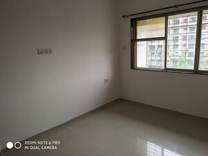 Room in 2 BHK Apartment at Dheeraj Godavari Apartment, Malad West – for Sale