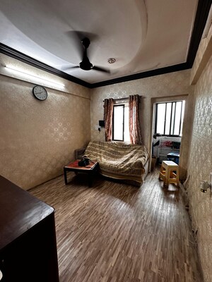 Living Room in 1 BHK Apartment at Vile Parle West – for Rent