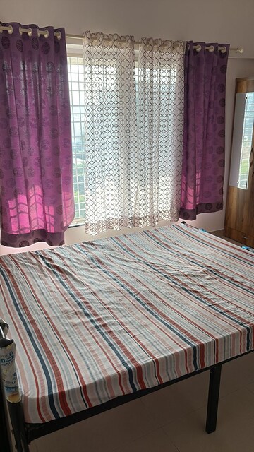 Bedroom in 2 BHK Apartment at Kolte Patil Aleria, Kharadi – for Rent