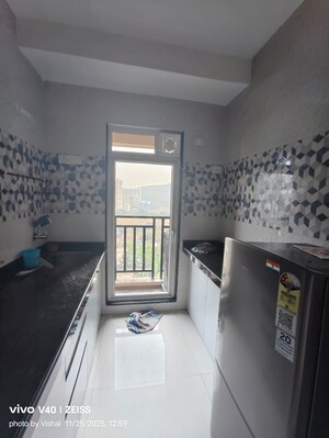 Kitchen in 2 BHK Apartment at Cosmos Jewels, Ghodbunder Road – for Rent