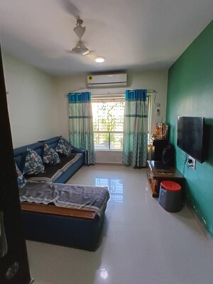 Living Room in 2 BHK Apartment at Lokhandwala Whispering Palms, Kandivali East – for Sale