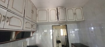 Kitchen in 2 BHK Apartment at Alica Nagar CHS, Kandivali East – for Sale