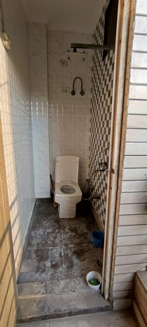 Bathroom in 3 BHK Builder Floor at Dwarka Mor – for Rent