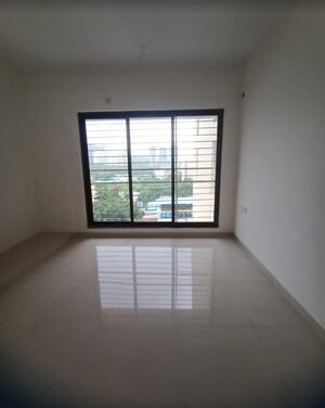 Room in 2 BHK Apartment at Acme Ozone, Manpada – for Sale