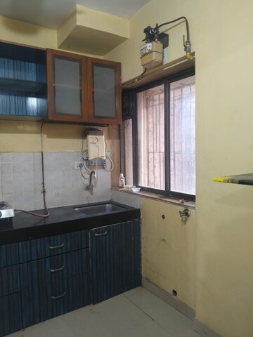Kitchen in 2 BHK Apartment at Runwal Garden City, Balkum Pada – for Rent