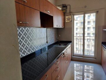 Kitchen in 2 BHK Apartment at Shree Tirupati STG Signature Residency, Patlipada – for Rent