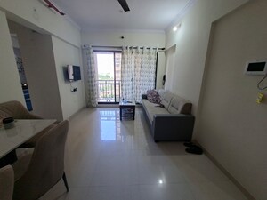 Living Room in 1 BHK Apartment at Raunak Bliss, Ghodbunder Road – for Rent