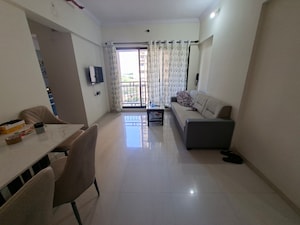 Living Room in 1 BHK Apartment at Raunak Bliss, Ghodbunder Road – for Rent