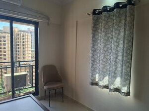 Living Room in 1 BHK Apartment at Raunak Bliss, Ghodbunder Road – for Rent