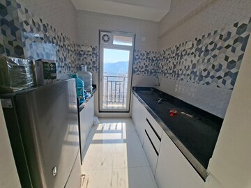 Kitchen in 1 BHK Apartment at Raunak Bliss, Ghodbunder Road – for Rent