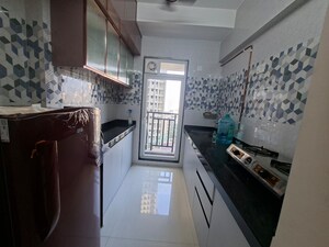 Kitchen in 1 BHK Apartment at Raunak Bliss, Ghodbunder Road – for Rent