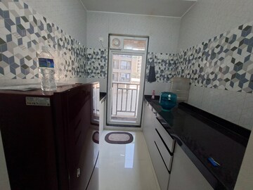 Kitchen in 1 BHK Apartment at Raunak Bliss, Ghodbunder Road – for Rent