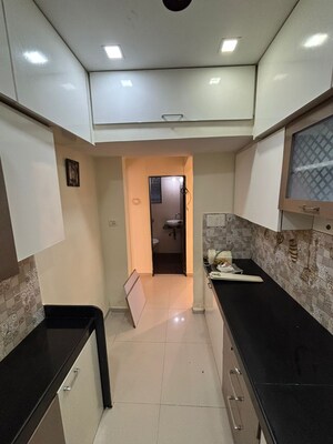 Kitchen in 2 BHK Apartment at Green Acres Apartment, Waghbil – for Rent