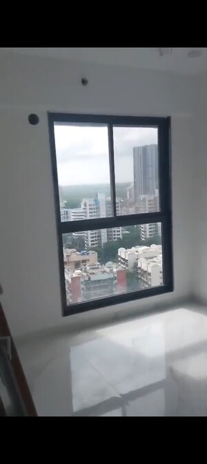 Room in 2 BHK Apartment at Dev Leo Tower, Oshiwara – for Rent