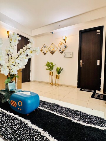 Living Room in 2 BHK Apartment at Urbtech Xaviers, Sector 168 – for Rent