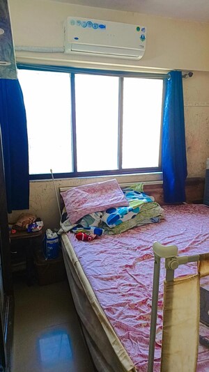 Bedroom in 1 BHK Apartment at Ram Pushpanjali Residency, Owale – for Sale