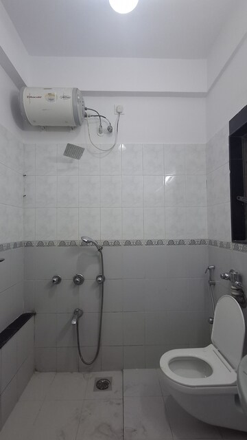 Bathroom in 3 BHK Apartment at Bredco New Viceroy Park , Kandivali East – for Rent