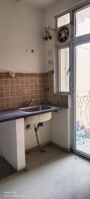 Kitchen in 2 BHK Apartment at Mahagun Mywoods, Sector 16c Greater Noida – for Rent