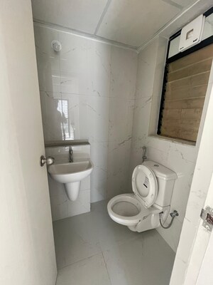 Bathroom in 1.5 BHK Apartment at Runwal Gardens Phase I, Dombivli East – for Rent