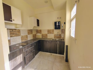 Kitchen in 2 BHK Apartment at Amrapali Enchante, Tech Zone 4 Greater Noida – for Rent