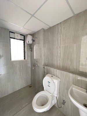 Bathroom in 1 BHK Apartment at Runwal Gardens Phase I, Dombivli East – for Rent