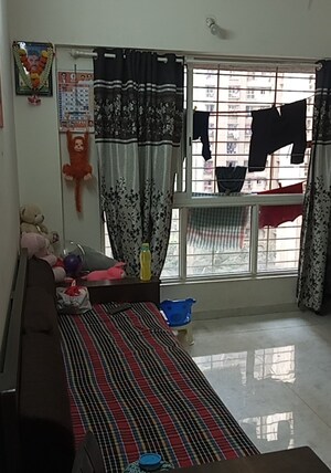 Living Room in 1.5 BHK Apartment at Lodha Amara, Kolshet Road – for Sale