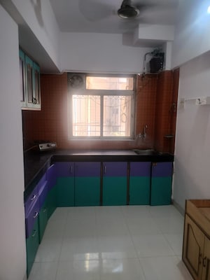Kitchen in 1 BHK Apartment at Krishna Greenland Park Vastu Federation, Ghodbunder Road – for Rent