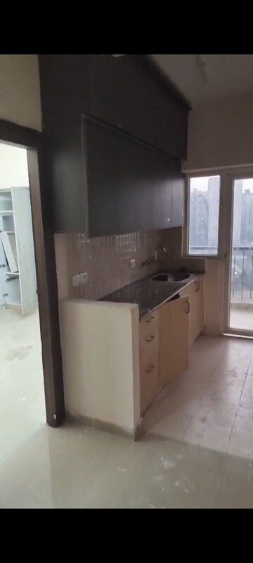 Kitchen in 1 BHK Apartment at Amrapali Dream Valley, Tech Zone 4 Greater Noida – for Rent