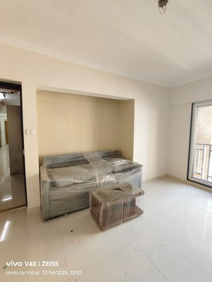 Living Room in 1 BHK Apartment at Raunak Bliss, Ghodbunder Road – for Rent