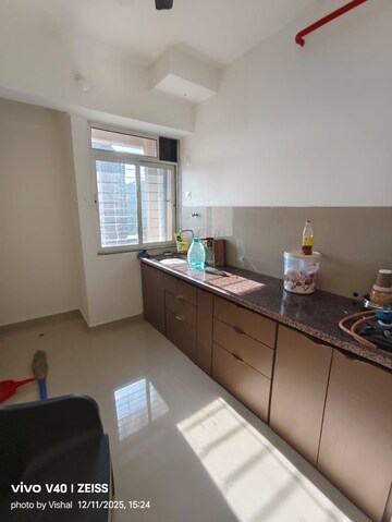 Kitchen in 1 BHK Apartment at Puranik Tokyo Bay Phase 2A, Kasarvadavali – for Rent