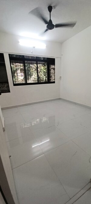 Living Room in 1.5 BHK Apartment at Dharti CHS, Malad West – for Rent