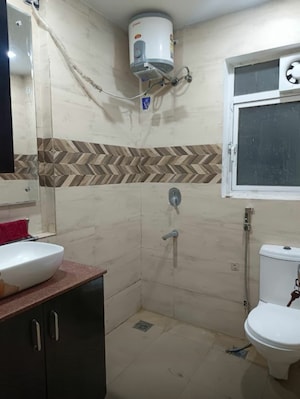 Bathroom in 2.5 BHK Builder Floor at Mansarover Garden – for Rent