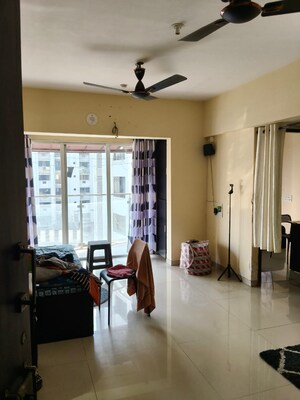 Living Room in 1 BHK Apartment at Lotus Lotus Link Square, Malad West – for Rent