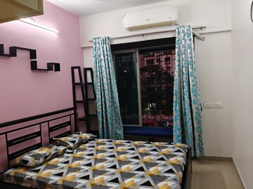 Bedroom in 2 BHK Apartment at Satellite Garden, Goregaon East – for Rent