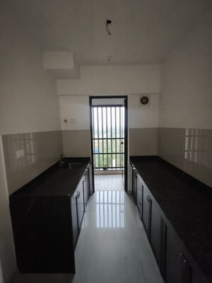 Kitchen in 1 BHK Apartment at Lodha Lakeshore Greens, Dombivli East – for Sale