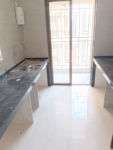 Kitchen in 2 BHK Apartment at Regency Antilia Phase V Avana, Ulhasnagar – for Sale